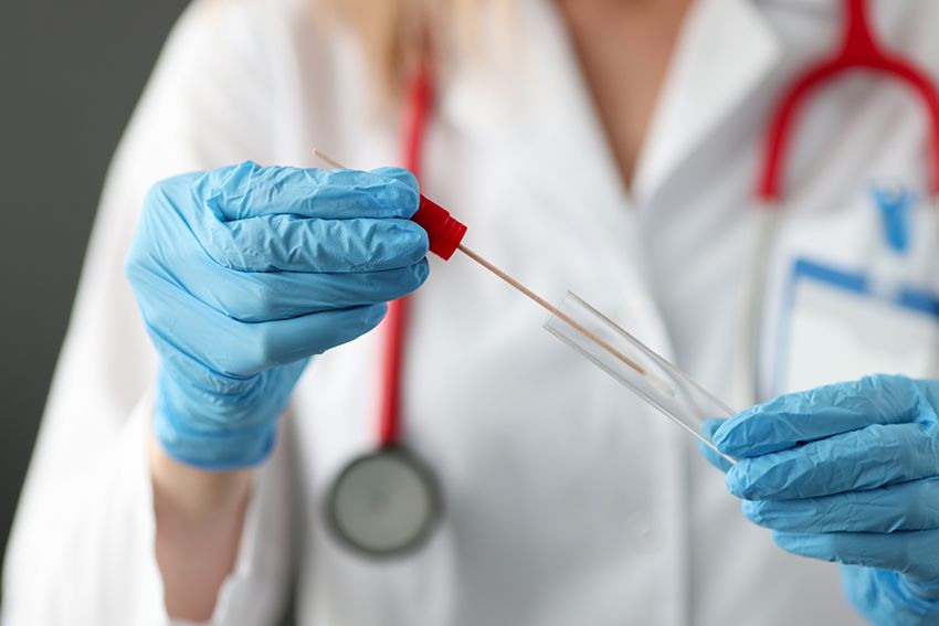doctor-wearing-gloves-inserting-cotton-swab-into-test-tube-closeup-dna-determination-paternity-concept.jpg